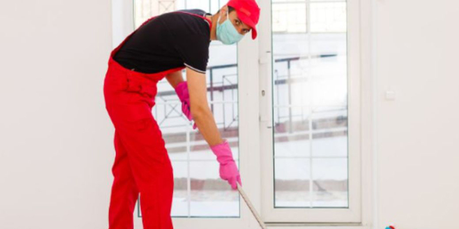 This image shows a man cleaning the floor.